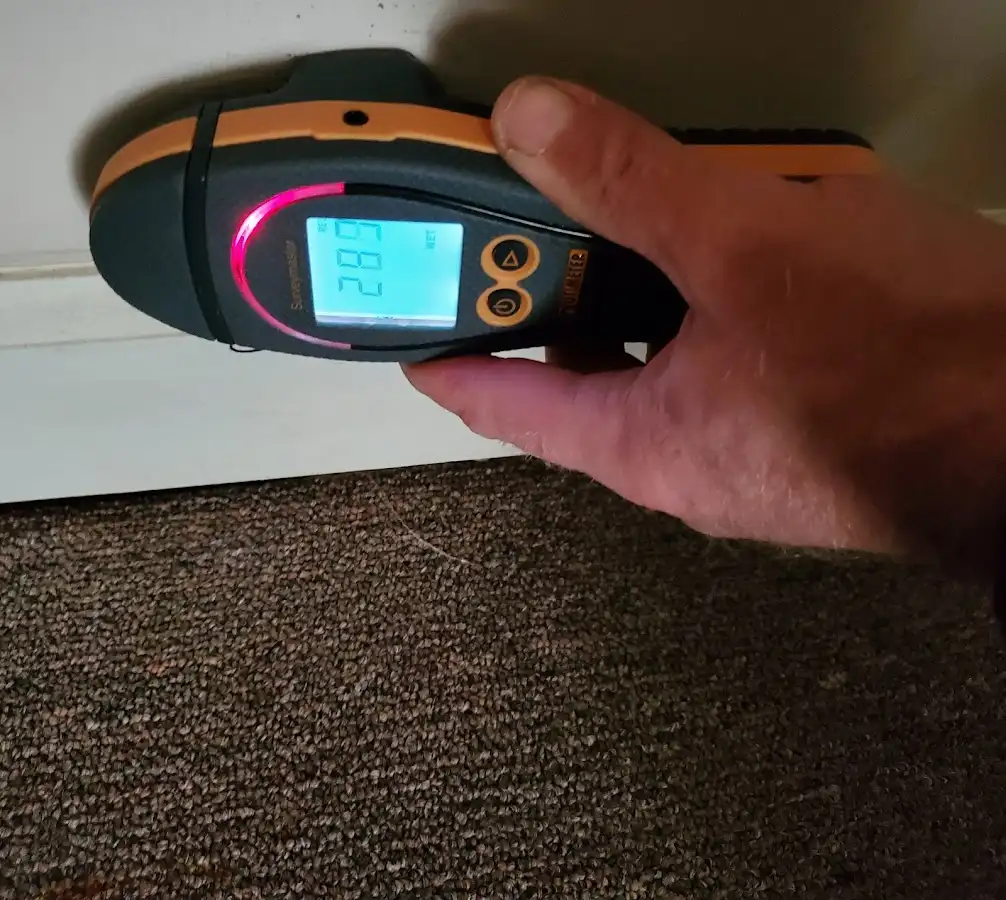 Moisture detection at baseboard during Storm Damage Restoration in Rib Mountain